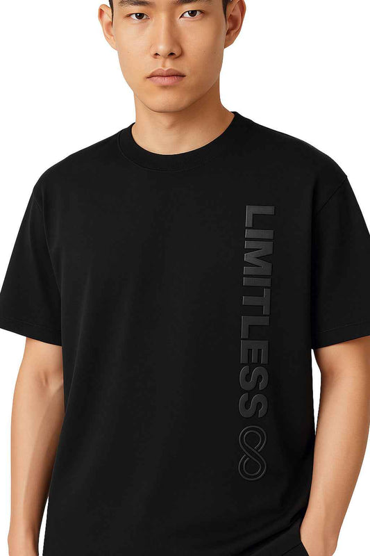 Close-up of Infinite Limitless Men's Streetwear T-Shirt showing bold 3D embossed 'LIMITLESS' vertical text and infinity symbol on chest.