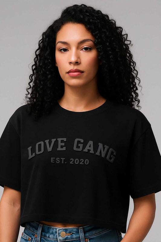 Close-up of Love Gang Women’s crop top showing black-on-black 'LOVE GANG EST. 2020' print. Ideal for bold, minimalist fashion statements.