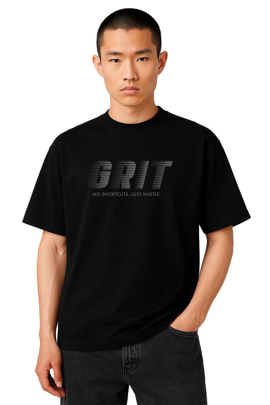 GRIT - No Excuses men's oversized black t-shirt with 3D embossed graphic, styled with relaxed fit and dropped shoulders for casual wear.