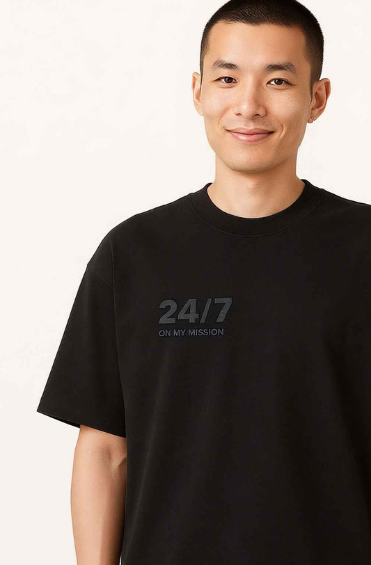 Close-up front angle of 24/7 ON MY MISSION - Men's Streetwear T-Shirt showcasing subtle embossed chest design. Sustainable and stylish streetwear.