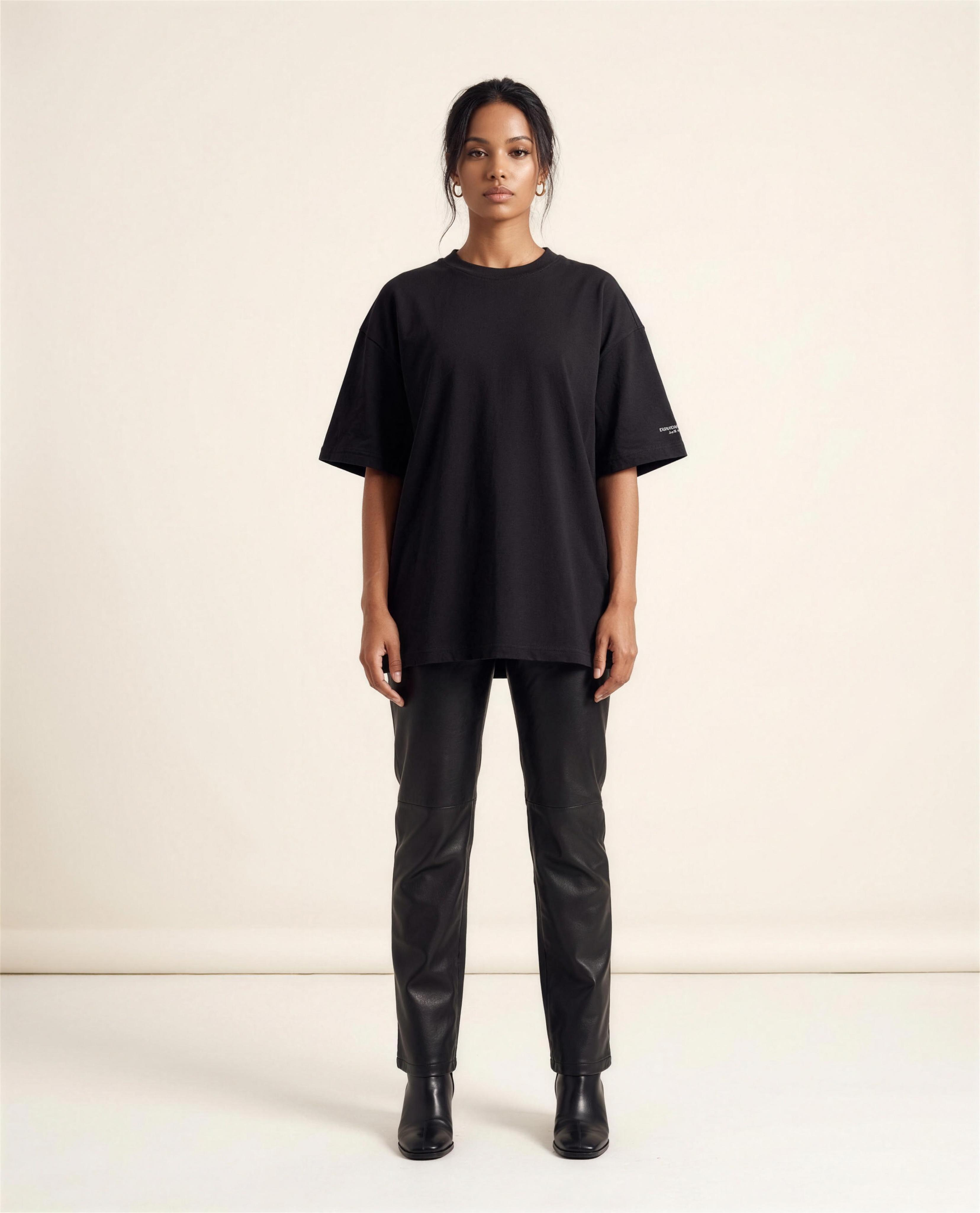 Model wearing the black oversized New York Ain't for Everybody tee, front view