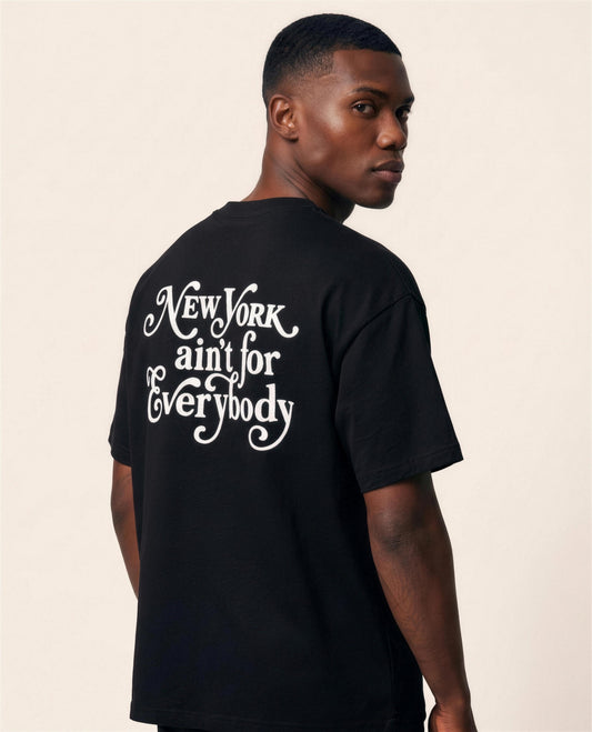 New York Ain't for Everybody Men's Tee in black - over-the-shoulder view of the white script back print - Grind n Flow